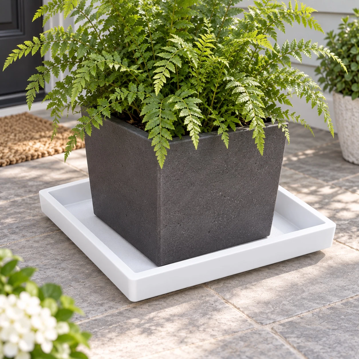 Insulating Square Plant Saucer in a garden setting
